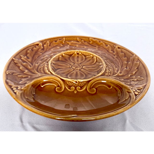 1970s French majolica artichoke plate. Beautiful amber gold glaze. Center well with medallion for artichoke, border well...