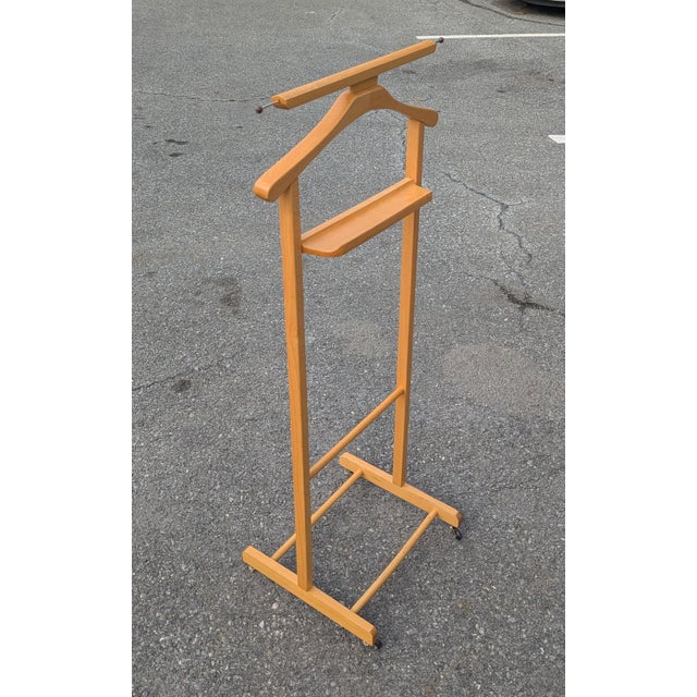 A masterpiece of mid-century sartorial history, this 1960 Italian standing valet—often referred to as a "silent valet" or...