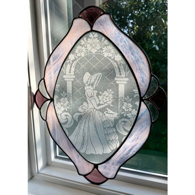 A extraordinary, one-of-a-kind, vintage leaded stained glass statement panel featuring an intricate, woven Dutch picture...
