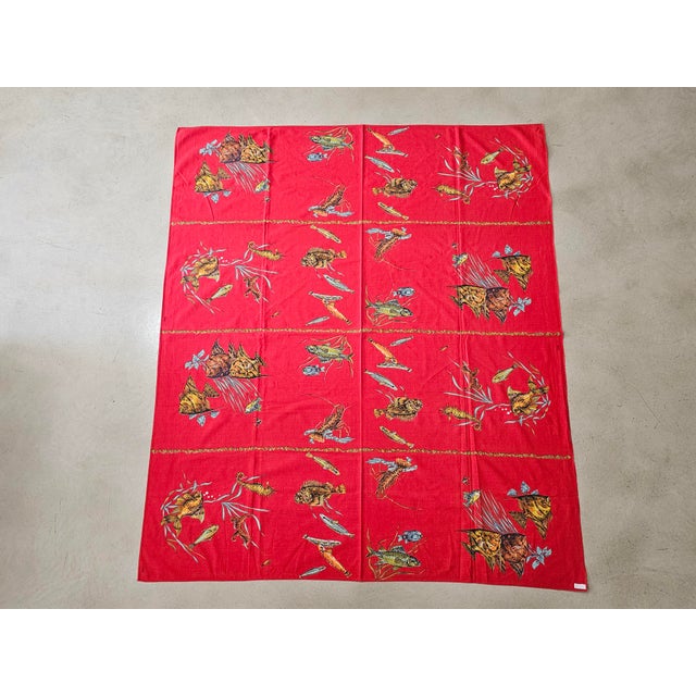 A striking vintage cotton table linen set dating from the 1970s, comprising one tablecloth and eight matching napkins, all...