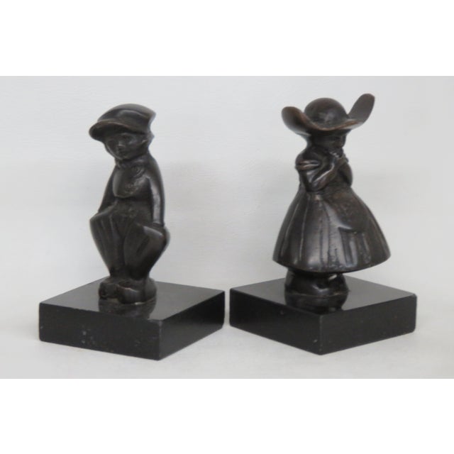 This gorgeous Figurines is made of metal and stone. This wonderful pair of figurines is wonderfully sculpted of a Dutch...