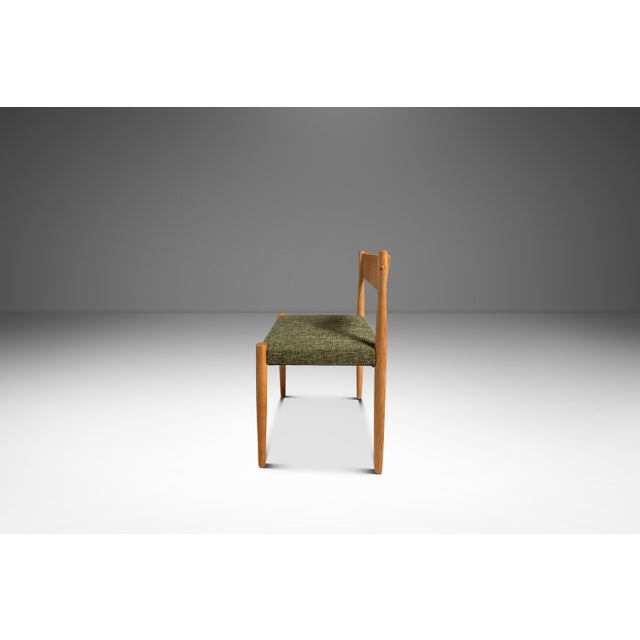 This handsome Mid-Century Danish Modern side/dining chair by Poul Volther for Frem Røjle showcases the refined simplicity...