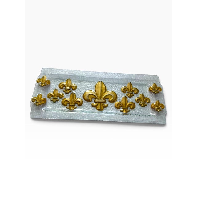 Elegant vintage rectangular glass tray featuring an ornate arrangement of raised fleur-de-lis motifs finished in lustrous...