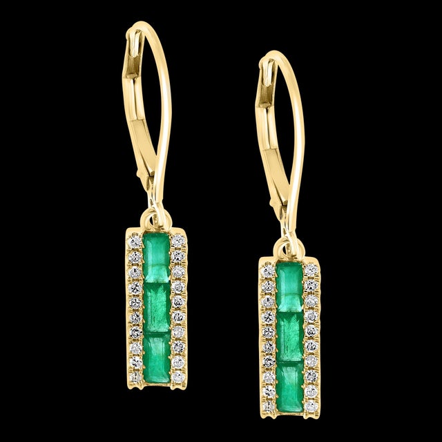 Princess Cut Emerald &amp; Diamond 14 Kt Yellow Gold Dangling Earring Princess cut Emerald in the Center row Each side of...
