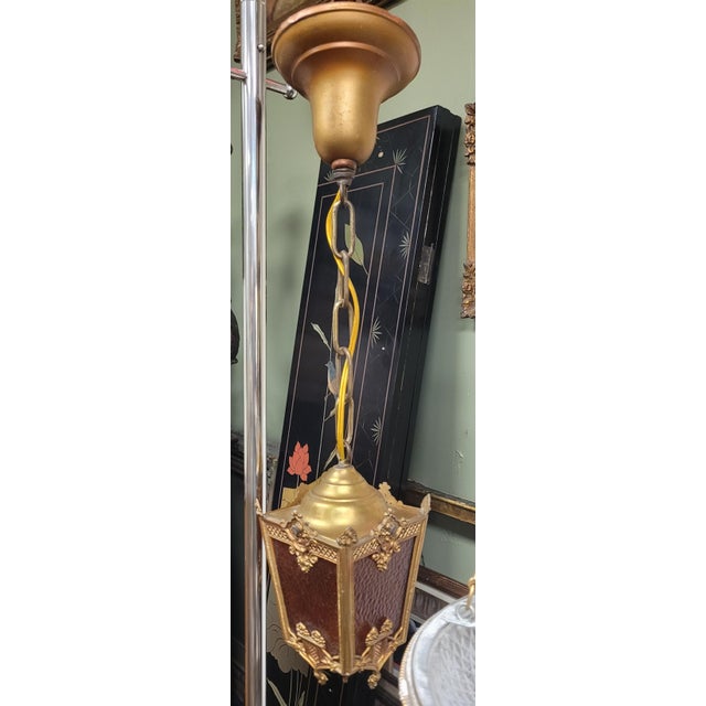 Find antique 1920s petite hanging Lantern pendant light. Features guilt white metal frame with amber glass panels and...