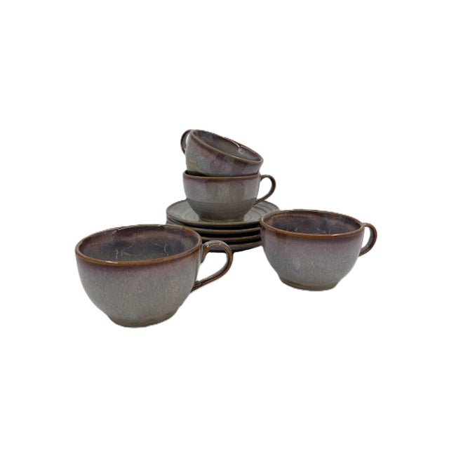 This elegant coffee cup/ saucer set for four showcases the refined artistry of Bat Trang, Vietnam, renowned for its...