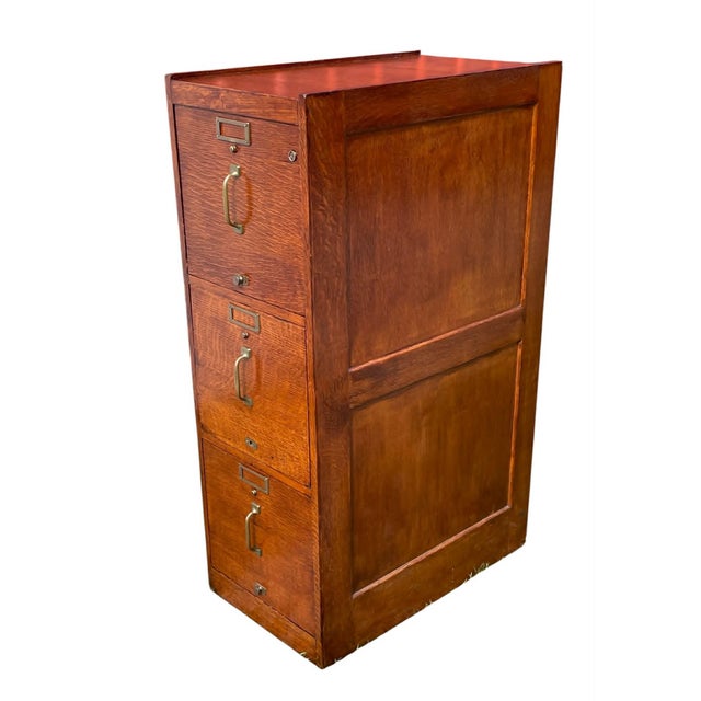 This is an early 1900's Three drawer Oak Filing Cabinet. Exceptionally well made and of high quality. I do not see a mfg....