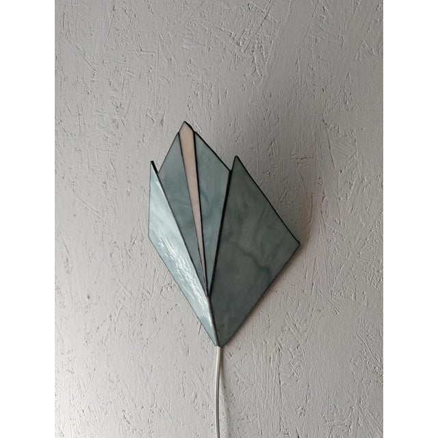 Vintage Stained Glass Wall Lamp 1970s. Geometric shapes, subtle color nuances, and artisanal glasswork come together in...