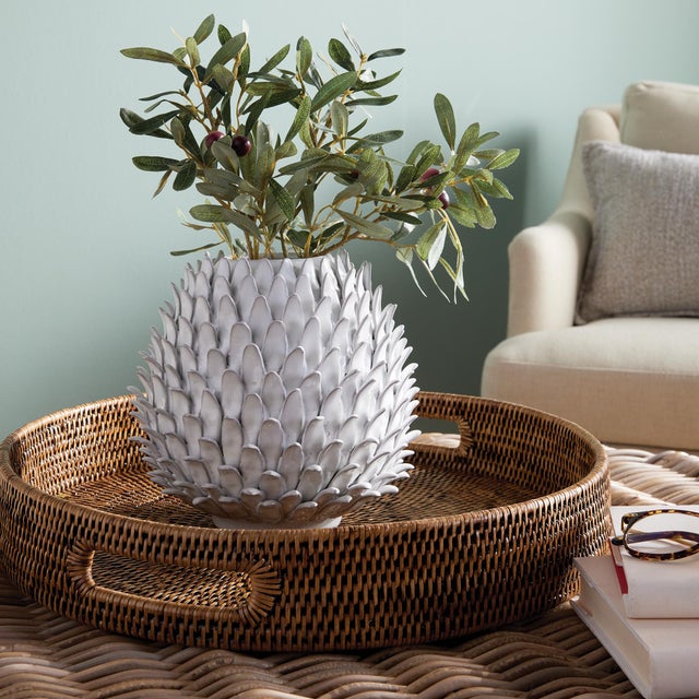 This Protea plant inspired vase is made by the hands of a skilled artisan. Each petal painstakingly applied, then glazed...