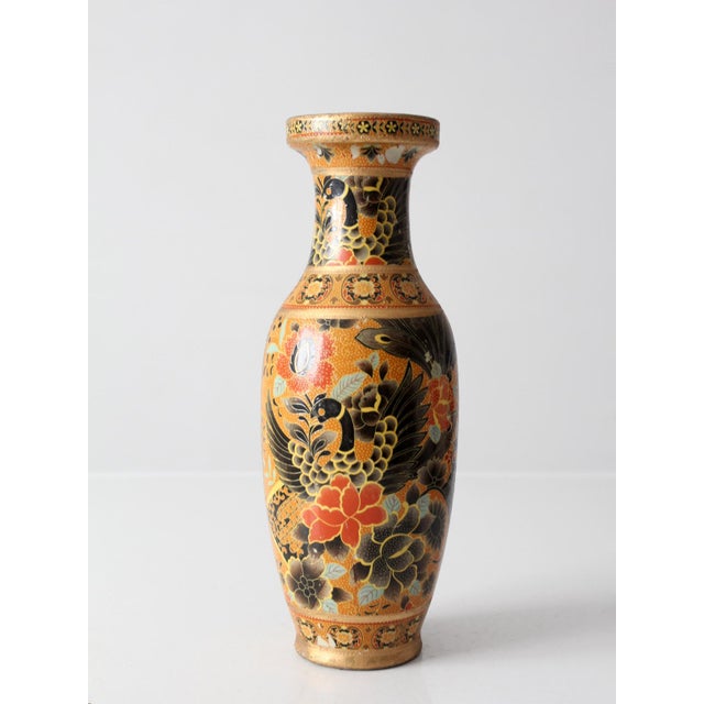 A mid-century Chinese porcelain vase richly decorated with phoenix birds, peonies, and layered floral borders in black,...
