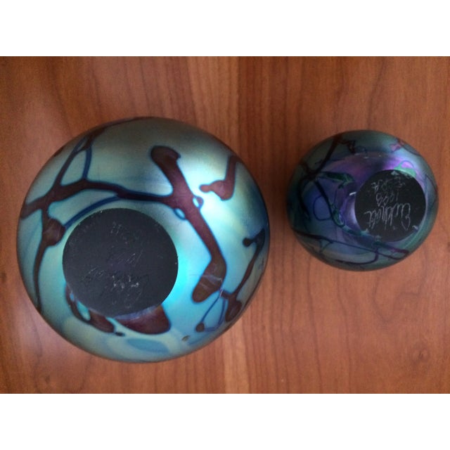 Elegant signed (Eickholt) and dated (1998) vases in striking colors: iridescent purple, cobalt blue and aqua. The two are...