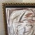 beautiful abstract portrait painting, good look and style. The painting is placed inside a gold frame, which adds a touch...