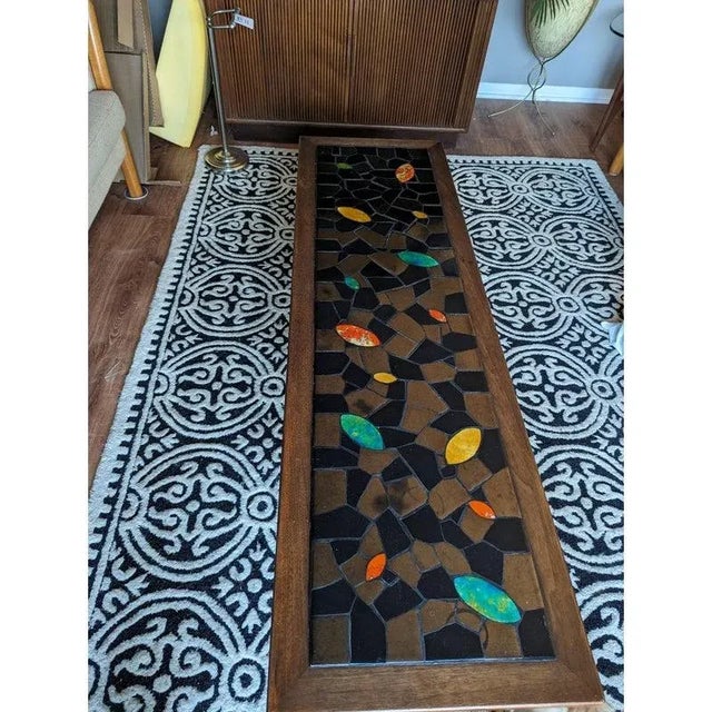 Absolutely stunning piece of mid-century. One of a kind. Curved legs. Various shapes and sizes of metallic copper and...