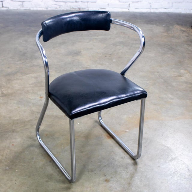 Fantastic vintage Art Deco Streamline & Art Moderne side chair composed of a chrome tube frame & black vinyl back & seat...