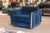 A pair of Milo Baughman cube club chairs. This lovely pair of modern accent lounge chairs feature a bright blue velvet...