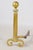 A commanding pair of 31-inch brass andirons combining classical fluted columns, oversized ball finials, and beautifully...