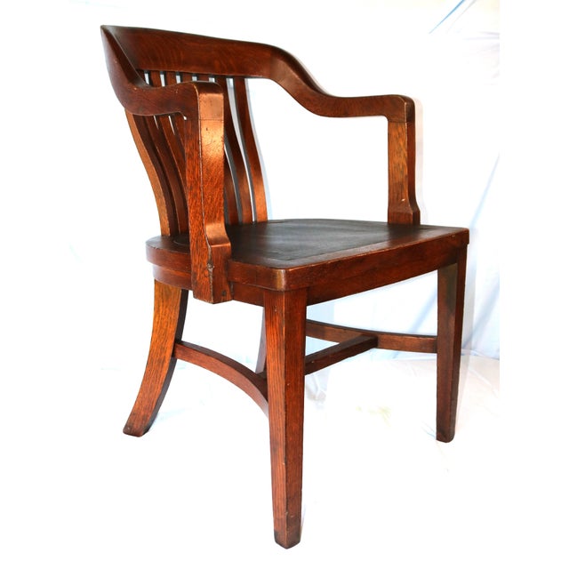 This attractive chair is in good overall condition for its age and looks nice from all angles. The top rail and arms show...