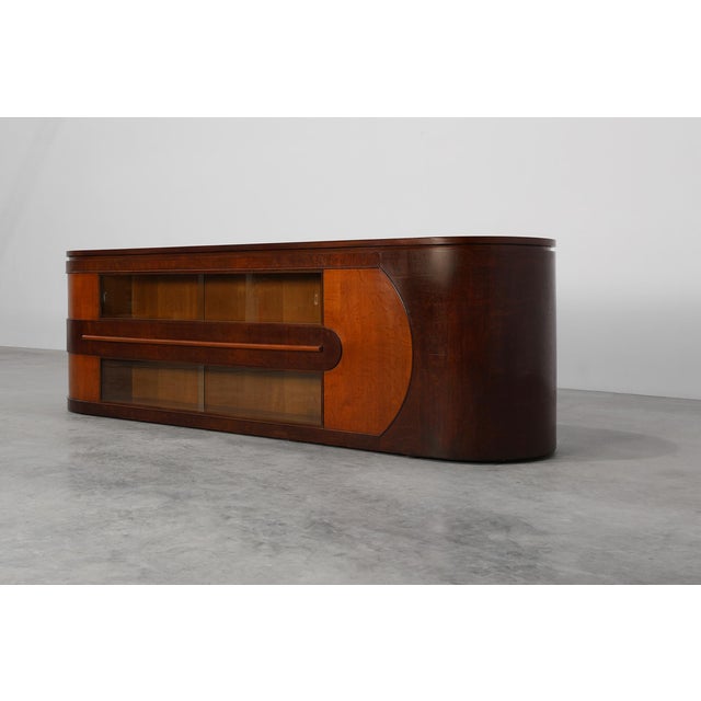 A commanding example of Belgian Art Deco craftsmanship, this large 1920s counter by De Coene has been professionally...