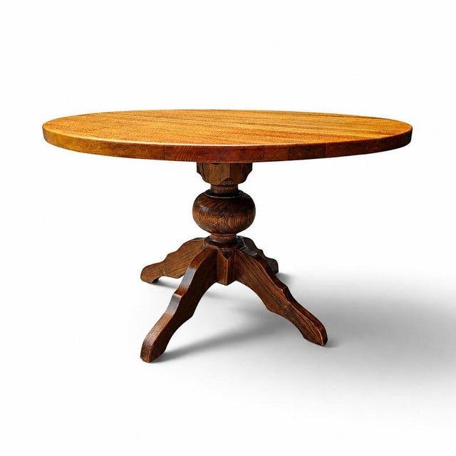 solid oak dining table / also known as a monastery table / with a sturdy central pedestal / Its heavy-duty construction...