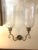 In the style of George III (1760-1820), this handsome pair of English double brass hurricane sconces feature graceful...