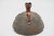 A stoneware piece, scarified and signed underneath, in perfect condition. This piece has an attribution mark, I am sure...