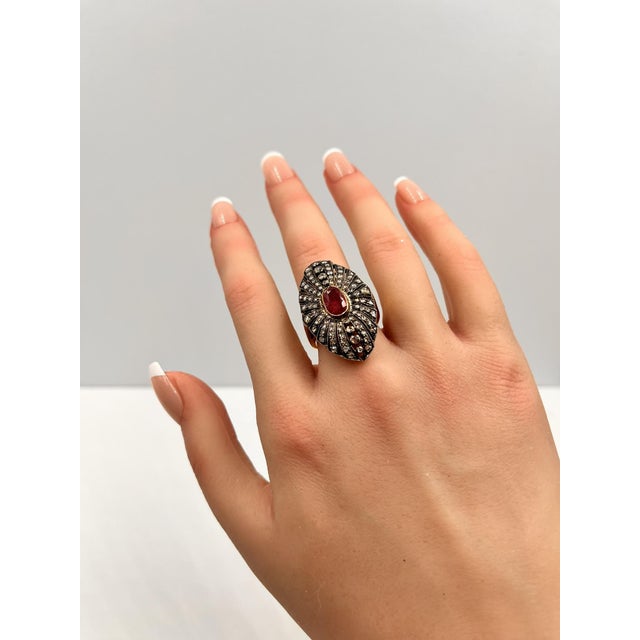 Discover the allure of the Iris Fine Jewelry Ruby and Diamond Ring. This exquisite piece showcases a captivating 1.3 carat...
