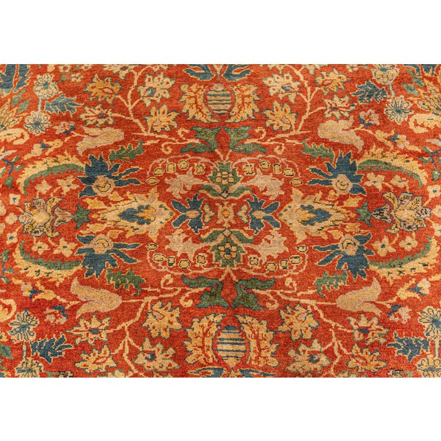 This antique North Indian rug circa 1920 is a beautiful tableau of traditional oriental themes and floral designs in...