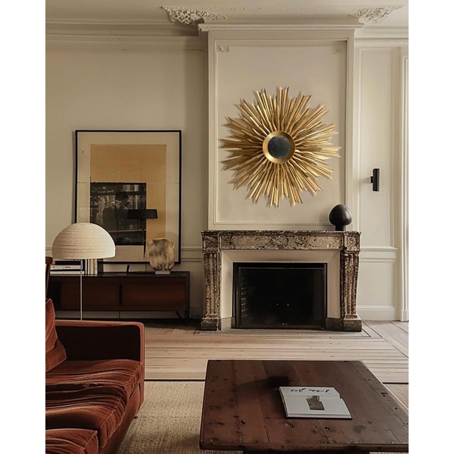 Restored sunburst mirror from 20th Century. Composed of a double row of gilded wooden rays and an minimal and...