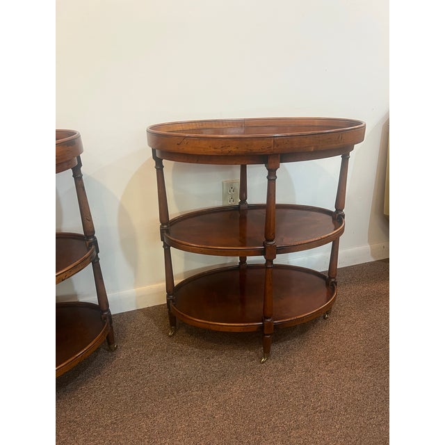 This is an amazing set of matching Burlwood side tables by Henredon. English European notes of 19th century luxury. The...
