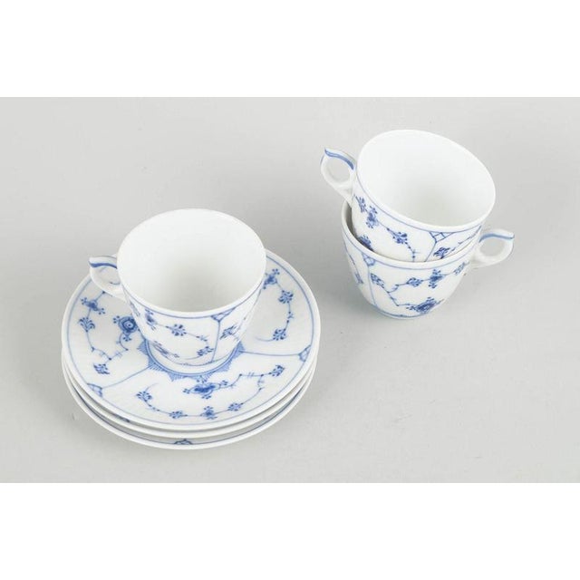 Royal Copenhagen Blue Fluted Plain, set of three coffee cups with saucers. Three coffee cups with matching saucers in...