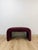 This burgundy/mauve upholstered bench brings a bold, sculptural presence to any room, embodying the confident, form-driven...