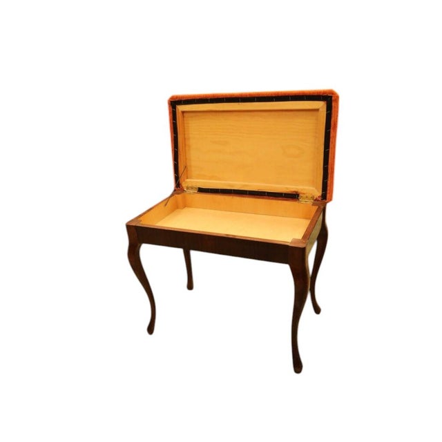 Elegant piano stool in mahogany with softly curved legs and a newly upholstered seat in a beautiful, high-quality corduroy...