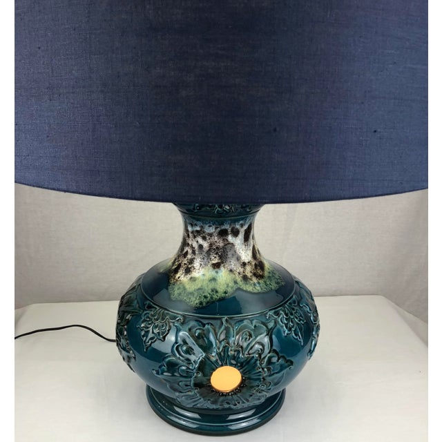 Very decorative table lamp in a stunning array of blue and beige colors. This Mid-Century Modern ceramic table lamp has...