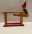 This is a lovely antique handmade and handpainted toy. It features an acrobatic clown manually set upon two parallel...