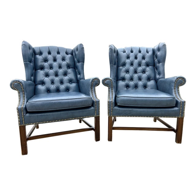 Mid-Century Chesterfield Wingback Chairs, a Pair - Tufted Blue Faux Leather With Nailhead Detailing For Sale