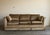 A pair of late 20th century sofas in champagne velvet, built on a clean squared frame with canted arms and a tailored kick...