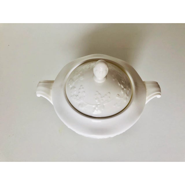 90's white with floral pattern lidded sugar bowl 4.5"D X 3"H , makers mark reads " Mikasa Made in Japan Dish Washer Safe "...