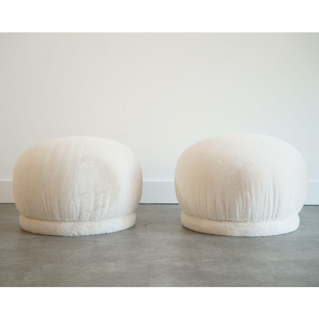 A striking pair of 1970s swiveling poufs by Directional Furniture, fully restored and reimagined for modern interiors....