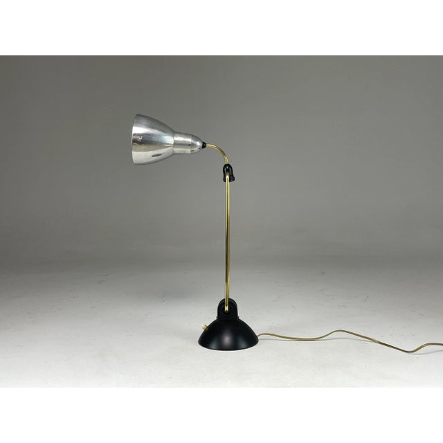 A cool 20th-century industrial French table or desk light produced in the 1930's. This piece stands out through its...