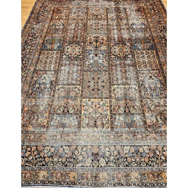 "A visually captivating early 20th century Persian Khorassan rug showcasing an exceptional allover panel design — a motif...