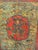 A commanding pair of large antique Tibetan wooden cabinet doors featuring hand-painted warrior figures amid intricate...