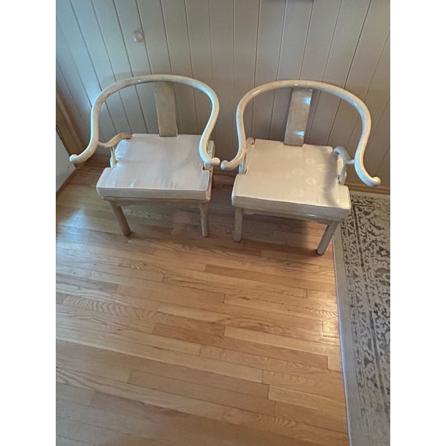 Asian inspired whitewashed horseshoe chairs - pair. Great vintage condition- comes with cushions. Slight wear under one.