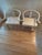 Asian inspired whitewashed horseshoe chairs - pair. Great vintage condition- comes with cushions. Slight wear under one.