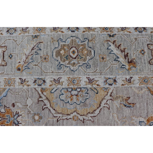Turkish Angora Oushak Rug With Light Gray Field and Warm Earth Tone Accents For Sale - Image 9 of 17