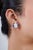 These cluster stud earrings feature 18.2-carat luminous oval cabochon opal multi sapphires, set in 18k white gold. The...