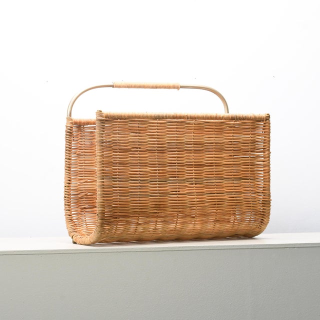 Crafted from natural rattan—a durable, flexible palm vine sourced sustainably from tropical regions—this magazine rack...