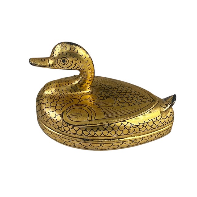 This charming Burmese trinket box showcases traditional lacquerware craftsmanship, featuring a duck form adorned with gold...
