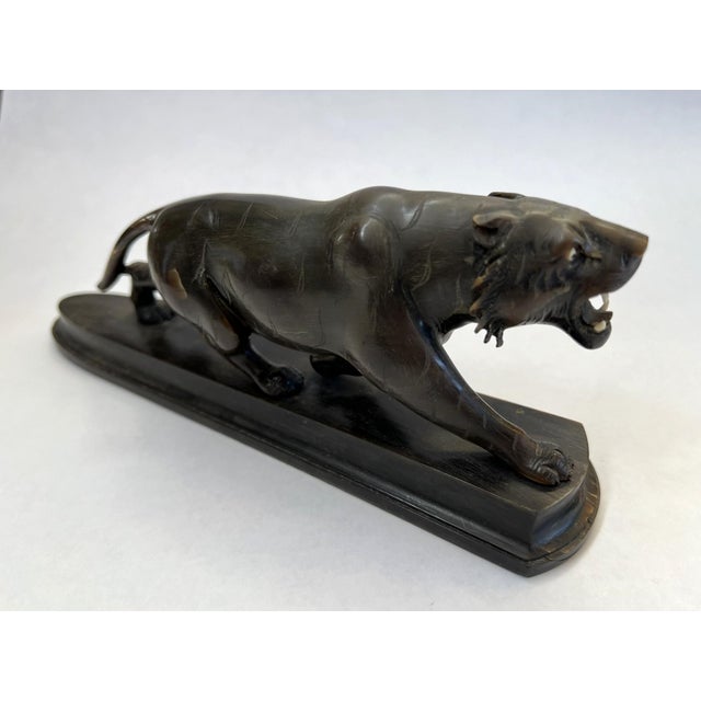 This is a very realistic and ferocious Panther mounted on a wood stand. The portrayal of the Panther is very realistic. It...