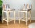 1970s comfortably padded stools with cushions seats and back, brass foot rest, solid wood painted cream white....