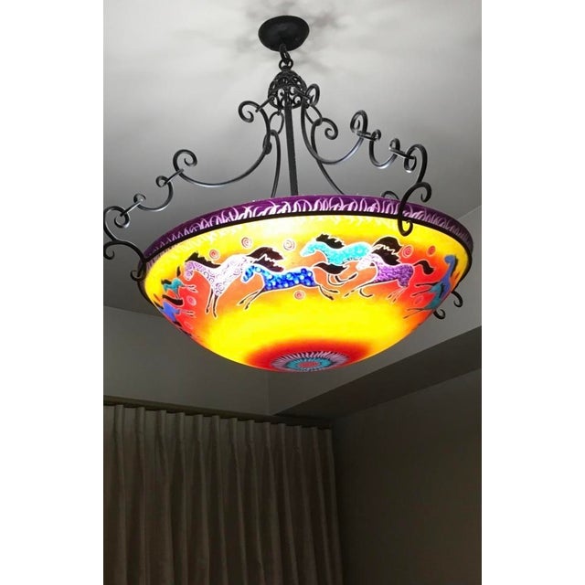 This is a signed Ulla Darni “Horses & Sunsets” Chandelier. I have extra S Hooks to add length.